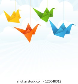 Origami paper birds flight abstract background.