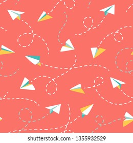 Origami paper planes with flight traces. Seamless vector pattern. Colorful paper planes flying on coral red background. Ideal for summer shirts, dresses, kidswear, resort textile, paper, stationery.