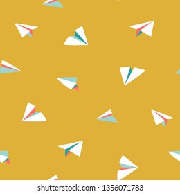 Origami paper planes flying. Bright colorful seamless vector pattern. Small white planes on yellow background. Ideal for summer shirts and dresses, kids wear, bags, textile, paper, stationery.