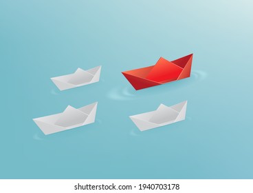 Origami red paper boat floating in front of white paper boats. Leadership concept.