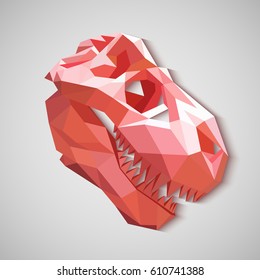 Origami skull of a dinosaur. Pink dinosaur made of paper.