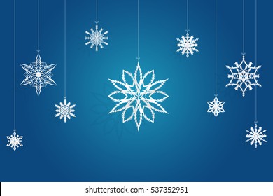 origami snowflake paper cut on blue background, for christmas day and happy new year
