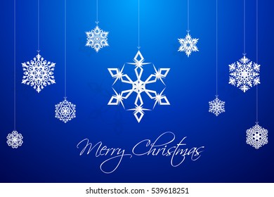 origami snowflake paper cut on blue background, for christmas day and happy new year