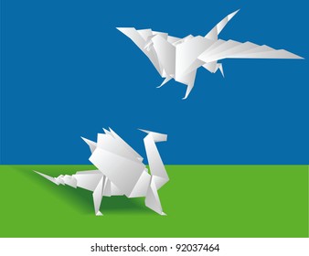 Origami. Two Chinese paper dragons on a green background