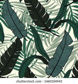 Original abstract seamless pattern with colorful tropical leaves and plants on a light background. Vector design. Jungle print. Flowers background. Printing and textiles. Exotic tropics. Fresh design.