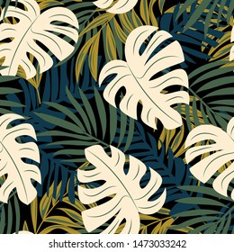 Original abstract seamless pattern with colorful tropical leaves and plants on black background. Vector design. Jungle print. Floral background. Printing and textiles. Exotic tropics. Summer.