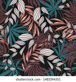 Original abstract seamless pattern with colorful tropical leaves and plants on brown background. Vector design.Exotic tropics. Summer. Jungle print. Floral background. Printing and textiles.