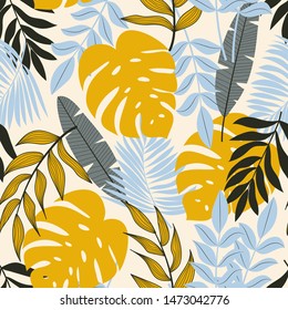 Original abstract seamless pattern with tropical leaves and bright plants on a delicate background. The seal of the jungle. Vector design. On a floral background. Textiles and printing. Exotic, tropic