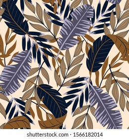Original abstract seamless pattern with tropical leaves and bright plants on beige background. The seal of the jungle. Vector design. On a floral background. Textiles and printing. Exotic, tropical.