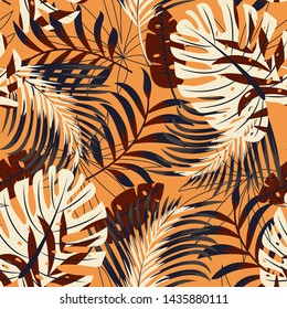 Original bright seamless pattern with colorful tropical leaves and plants on orange background. Vector design. Jungle print. Floral background. Printing and textiles. Exotic tropics. Summer design.