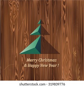 The original Christmas tree on wooden background texture