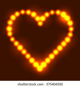 Original heart made from fire hot dots / pearls/ bulbs / circles on dark background