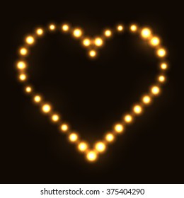Original heart made from gold dots / pearls/ bulbs / circles on dark background