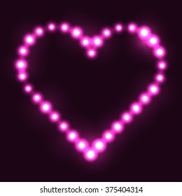 Corazón original hecho de puntos rosados/perlas/bombillas/círculos sobre fondo oscuro