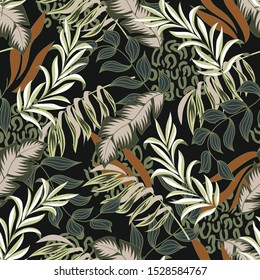 Original seamless tropical pattern with bright colorful leaves and plants on a dark background. 
Modern abstract design for fabric, paper, interior decor. Seamless exotic pattern with tropical plants.