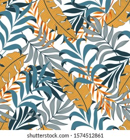 Original seamless tropical pattern with bright yellow and blue plants and leaves on a light background. Jungle leaf seamless vector floral pattern background. Beautiful exotic plants. 