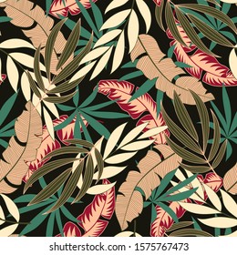 Original seamless tropical pattern with bright red and green plants and leaves on a dark background. Seamless pattern with colorful leaves and plants. Tropical botanical.