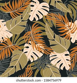 Original seamless tropical pattern with bright yellow and white plants and leaves on a green background. Colorful stylish floral. Jungle leaf seamless vector floral pattern background.