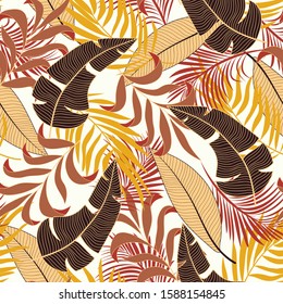 Original seamless tropical pattern with bright brown plants and leaves on a white background. Vector design. Jungle print. Floral background.  Seamless pattern with colorful leaves and plants.