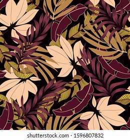 Original seamless tropical pattern with bright yellow and Burgundy plants and leaves on a black background. Beautiful exotic plants.  Trendy summer Hawaii print.