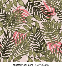 Original seamless tropical pattern with bright leaves and plants on a pastel background. Modern abstract design for fabric, paper, interior decor. Hawaiian style.