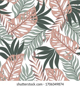 Original seamless tropical pattern with bright plants and leaves on a delicate background. Modern abstract design for fabric, paper, interior decor. Exotic wallpaper.