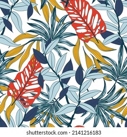 Original seamless tropical pattern with bright plants and leaves on a white background. Tropic leaves in bright colors. Seamless exotic pattern with tropical plants.