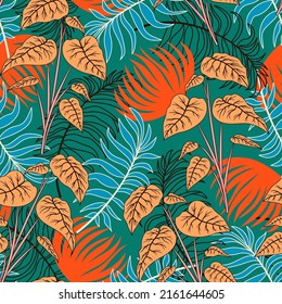 Original seamless tropical pattern with bright plants and leaves on a green background. Exotic jungle wallpaper. Exotic wallpaper. Colorful stylish floral. Summer colorful hawaiian.