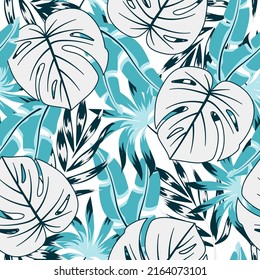 Original seamless tropical pattern with bright plants and leaves on a white background. Tropic leaves in bright colors. Summer colorful hawaiian seamless pattern with tropical plants.