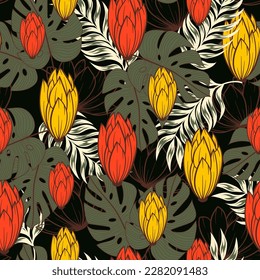 Original seamless tropical pattern with bright plants and flowers on a dark background. Beautiful exotic plants.  Exotic jungle wallpaper. Summer colorful hawaiian seamless pattern.