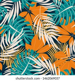 Original trend seamless pattern with bright tropical leaves and plants on a dark background. Vector design. Jungle print. Floral background. Printing and textiles. Exotic tropics. Summer design.