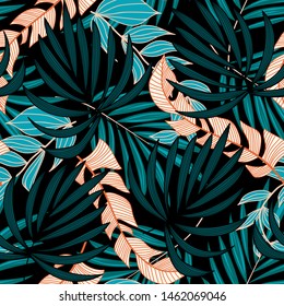 Original trend seamless pattern with bright tropical leaves and plants on a black background. Vector design. Jungle print. Floral background. Printing and textiles. Exotic tropics. Summer design.