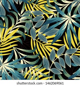 Original trend seamless pattern with bright tropical leaves and plants on a black background. Vector design. Jungle print. Floral background. Printing and textiles. Exotic tropics. Summer design.