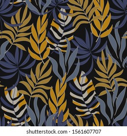 Original tropical seamless background with bright blue and yellow plants and leaves on a dark background. Beautiful exotic plants.  
Colorful stylish floral.
