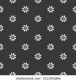 Original vector seamless pattern of vintage-style flowers on a black background. A design element.
