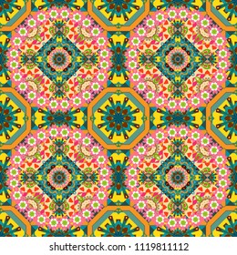 Ornament made of various yellow, blue and pink shapes. Random layout. Seamless abstract vector geometric pattern. Gift wrapping paper. Bed sheets and interior.