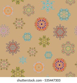 Ornamental artistic vector illustration in beige colors for Merry christmas cards. New Year 2017 collection. Beige snowflakes seamless pattern in abstract style. Freehand ethnic Xmas sketch.