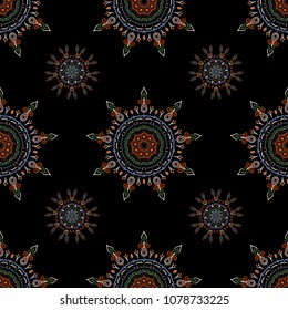 Ornamental artistic vector illustration for Merry christmas cards, fabric. New Year 2019 collection. Blue, brown and orange snowflakes seamless pattern in abstract style. Freehand ethnic Xmas sketch.