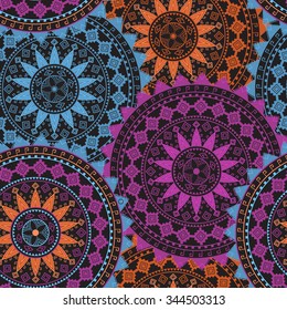 Ornamental circle pattern on black background. Mandala. Tribal, ethnic, african design