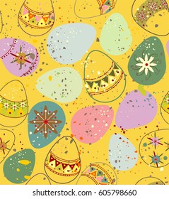 Ornamental Easter eggs in pink, purple, yellow, green, beige and red colors a seamless pattern on a yellow background.