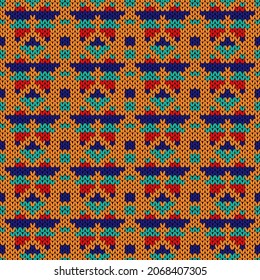 Ornamental knitting seamless vector pattern in turquoise, red, blue and orange colors as a fabric texture