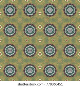 Ornamental motifs of the Indian fabric patterns. Mandalas ethnic seamless pattern in gray, green and magenta colors. Vector seamless ornament.