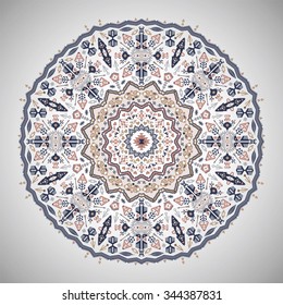 Ornamental round colorful geometric pattern in aztec style