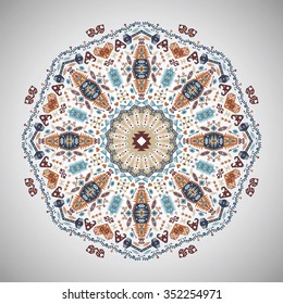 Ornamental round colorful geometric pattern in aztec style