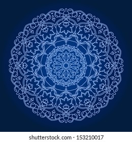Ornamental round lace pattern. Circle lace doily against dark background. 