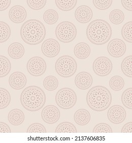 ornamental seamless mandala pattern with lacy ornaments on pastel pinkish background. Print for fabric wallpaper