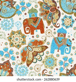 Ornamental seamless pattern, effect jeans texture. Floral wallpaper with decorative elephants, ornamental background