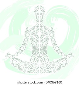 Ornamental silhouette of person sitting in lotus pose