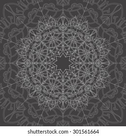 Ornamental vector mandala on the dark gray background