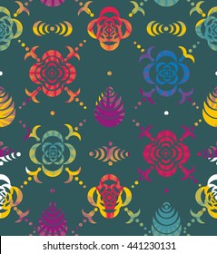 Ornaments from stencil of flowers and leaves in purple, red, yellow and green a seamless pattern on a blue green background.